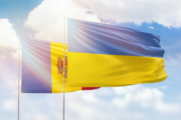 Sunny blue sky and flags of ukraine and moldova