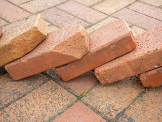 Old brickwork. Brick block. Demolition work. Stones on the ground.