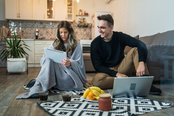 Couple man and woman sitting and working together online support each other with creative content Technology and working from home concept