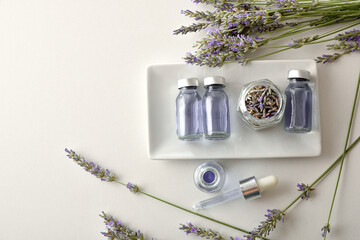 Medicinal lavender extract in vials on white table top view