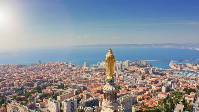 Marseille french port town in south France on Mediterranean sea coastline bay landscape beautiful sunny day panorama of Europe with basilica Notre-Dame de la Garde aerial touristic journey from drone