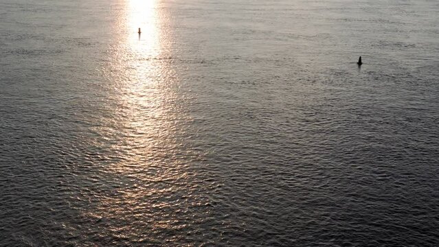 Top Aerial view moving fishing boat ocean. sailing motor boat with angler on Dnipro river at sunrise sunset. landscape of bridge over lakes in Kiev Ukraine city. water transport, travel, summer