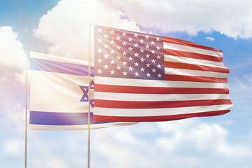 Sunny blue sky and flags of united states of america and israel