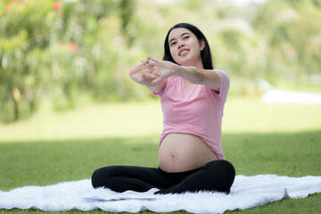 Happy young pregnant woman resting