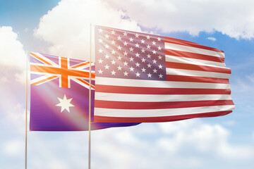 Sunny blue sky and flags of united states of america and australia