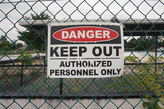 Danger Keep Out Sign on Cyclone Fence