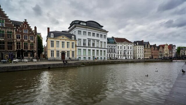Ghent time lapse of historic buildings on the waterfront by the river canal. Belgium