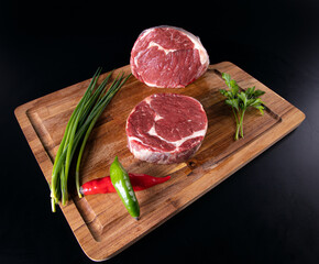 prime beef meat peper with black background and wood