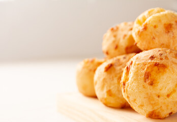 Delicious Minas Gerais cheese bread (Brazilian Pao de queijo), hot, copy space, white background, side view, focused