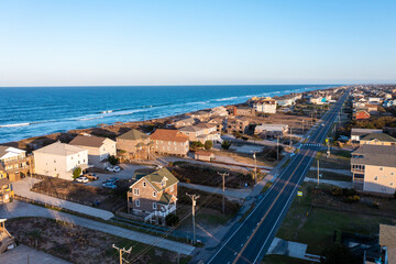 Obraz premium Aerial View of homes and the beach during golden hour in Nags Head North Carolina