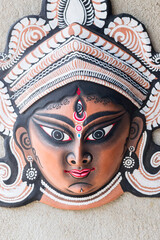 Purulia, West Bengal, India - August 15th 2017 : Colorful Chhau (or chhou) masks of Goddess Durga, handicrafts on display for sale. Chhou is a tribal dance in India.