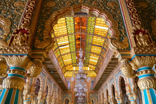 Mysore, Karnataka, India - November 25th 2018 : Beautiful decorated interior ceiling of the Private Durbar Hall, called Diwan-E-Khas, inside the royal Mysore Palace. Gold used on gilded ceiling.