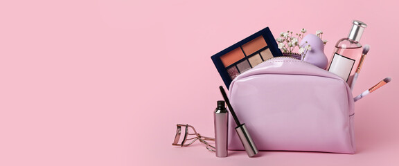 Bag with different cosmetics and accessories on pink background with space for text