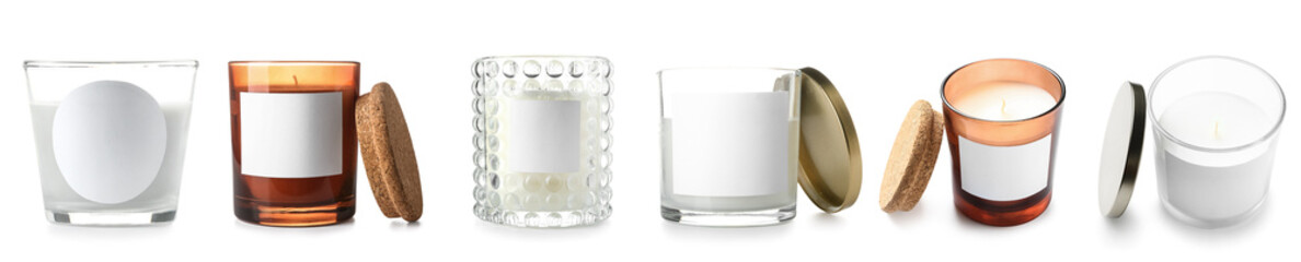 Set of aroma candles in holders on white background