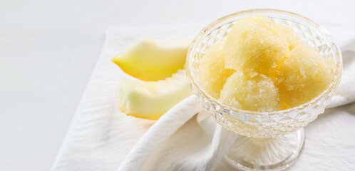 Bowl with tasty melon sorbet on light background