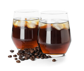Glasses of cold brew and coffee beans on white background