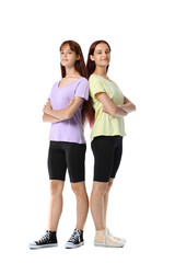 Teenage twin sisters on white background