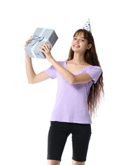 Teenage girl in party hat with gift box on white background