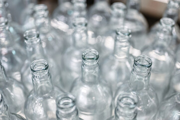 Group of glass bottles for alcohol drink on metal table