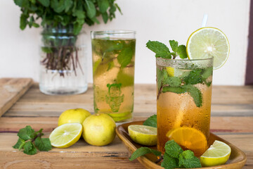herbal healthy drinks lemon tea for health care arrangement on background wooden