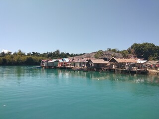 Fototapeta na wymiar Bajau tribal village housing located on the water