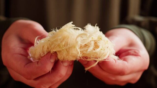 Turkish sweet food. Arabian cuisine. Pismaniye white halva close-up. Middle eastern national sugar treats, dessert snack.