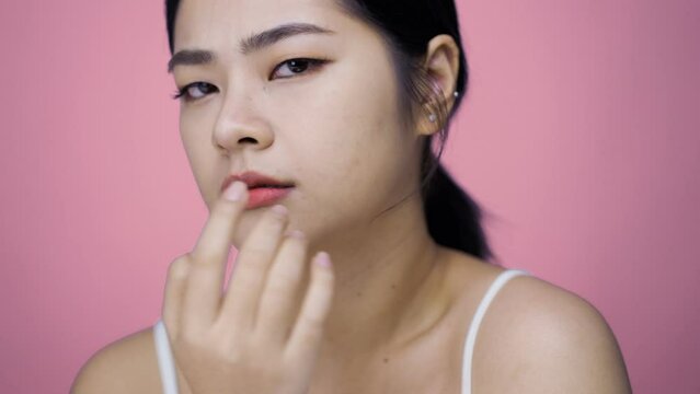 Unhappy millennial lady dissatisfied with skin condition, thinking of professional skincare products or cosmetologist meeting.