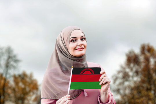 Muslim Woman In Hijab Holds Flag Of Malawi