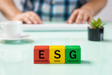 ESG inscription on the wooden blocks, enviroment, social responsibility,corporate governance,...