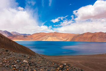 Play of shadows and light over beautiful Pangong Lake, Pangong Tso or Pangong Lake is an endorheic lake spanning eastern Ladakh and West Tibet situated at an elevation of 4,225 m. It is 134 km long.