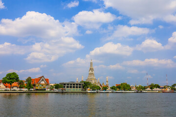 Bangkok,Thailand on May 1,2020:Beautiful scenery of Wat Arun Ratchawararam Ratchawaramahawihan(Temple of Dawn) on Thonburi bank of Chao Phraya River.