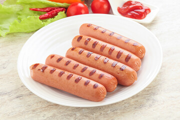 Grilled sausages with tomato sauce