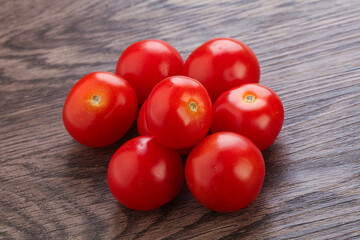 Ripe juicy cherry tomatoes heap