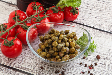 Marinated green capers in the bowl