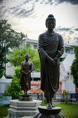 Buddha statues in various gestures at the Bodhi tree courtyard in Wat Benchamabophit.