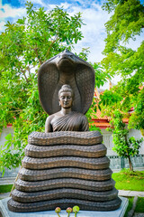 Buddha statues in various gestures at the Bodhi tree courtyard in Wat Benchamabophit.