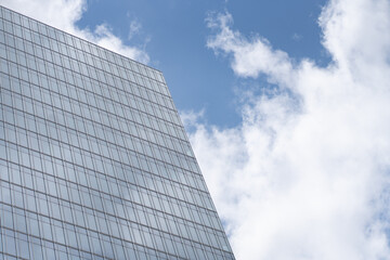 Plakat modern office building with sky and clouds