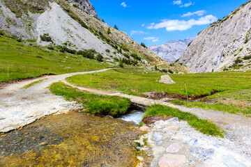 Fototapeta na wymiar View of beautiful mtb trail in Alpisella valley on sunny summer day, Alps Mountains, Italy