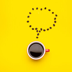 Top view black coffee or Americano in red cup and coffee beans on yellow