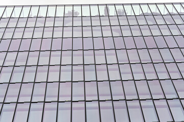 Fototapeta premium Beautiful and modern tall tower with clouds in the financial district. Wonderful skyscraper business office in the center city a beauty day