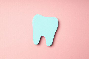 Concept of dental care or tooth care on pink background