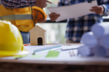 Architect contractor meetings of real estate brokers and company presidents to select a model to build a housing estate in writing and presenting to state organizations.