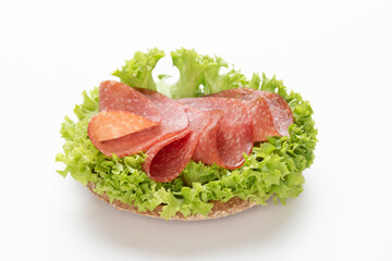 Sandwich with salami sausage on white background.
