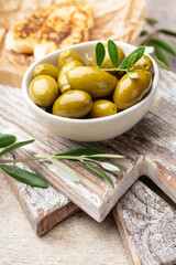 Green olives on gray background.