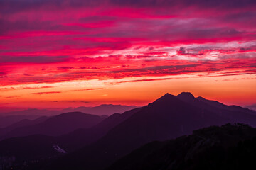 Fototapeta premium Scenic view of mountains against sky during sunset