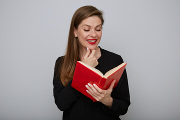 Teacher woman in black suit holding open red book. Isolated portrait of adult student.