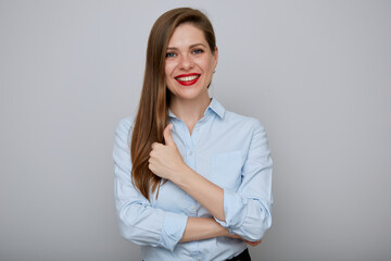 Smiling business woman showing thumb up, isolated female portrait.