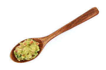 Spoon full of guacamole Mexican dip sauce isolated on white background