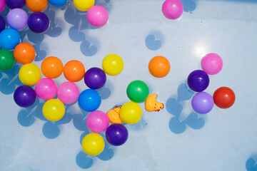 Colorful balls. holiday, children's party, a games room, a box filled with small colored balls. Many colorful plastic balls in a swimming pool.
