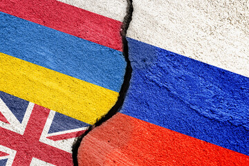 Flag of Russia and Ukraine, Poland, Great Britain on a cracked stucco wall as a concept of conflict...